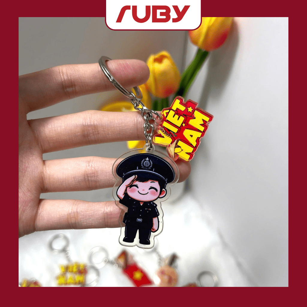 Móc khóa viền trong chibi chiến sĩ công an mặc sắc phục đen – kèm biểu tượng chữ Việt Nam, phụ kiện ý nghĩa dịp Quốc khánh.